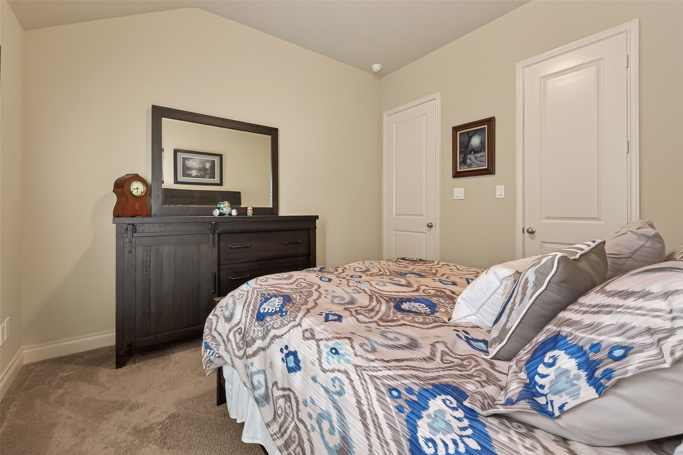 28435 Sycamore Falls Lane Fulshear, TX 77441 - Photo 29 of 46 a bedroom with a bed and a dresser