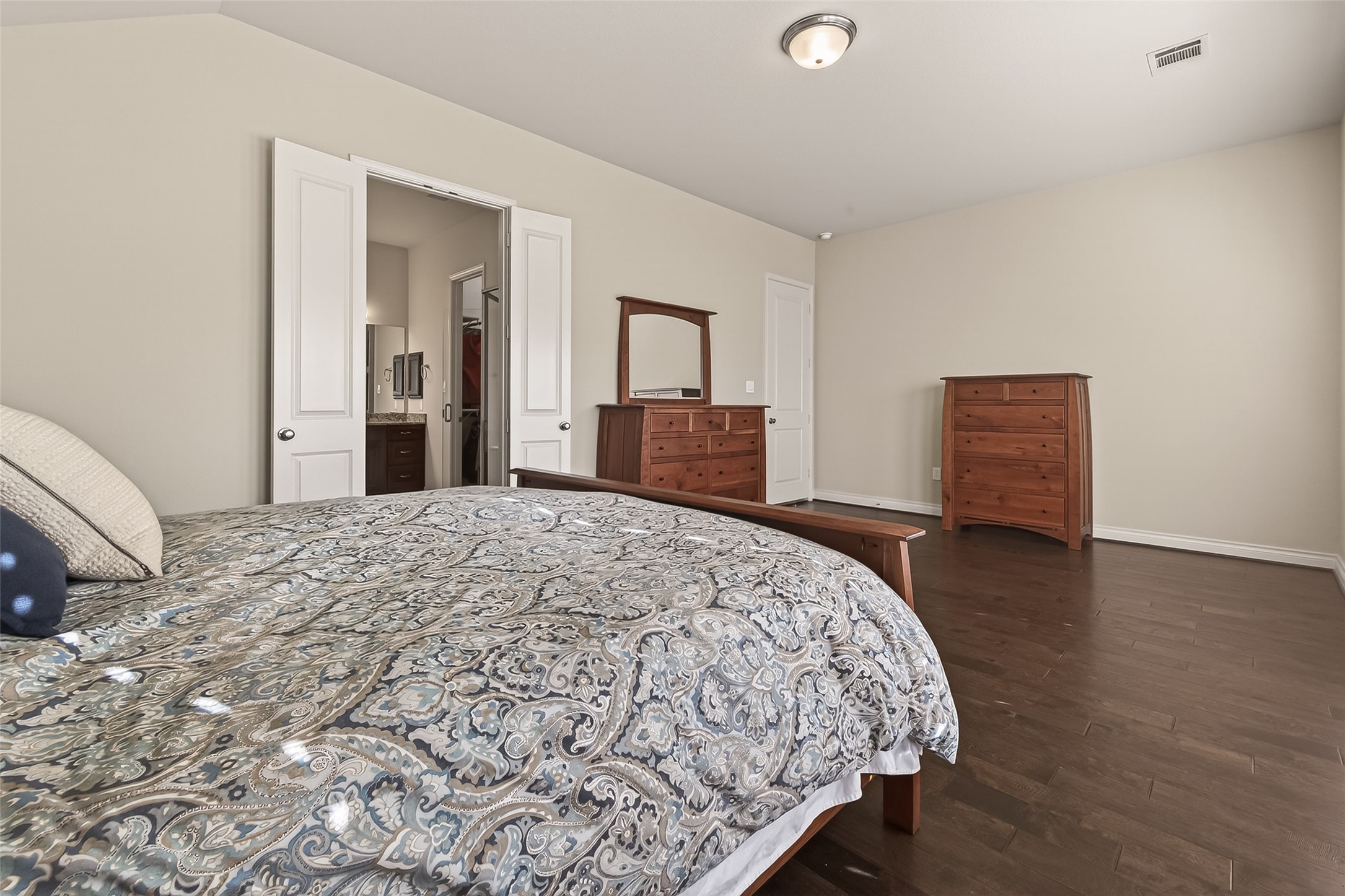 28435 Sycamore Falls Lane Fulshear, TX 77441 - Photo 37 of 46 a bedroom with a bed and a dresser