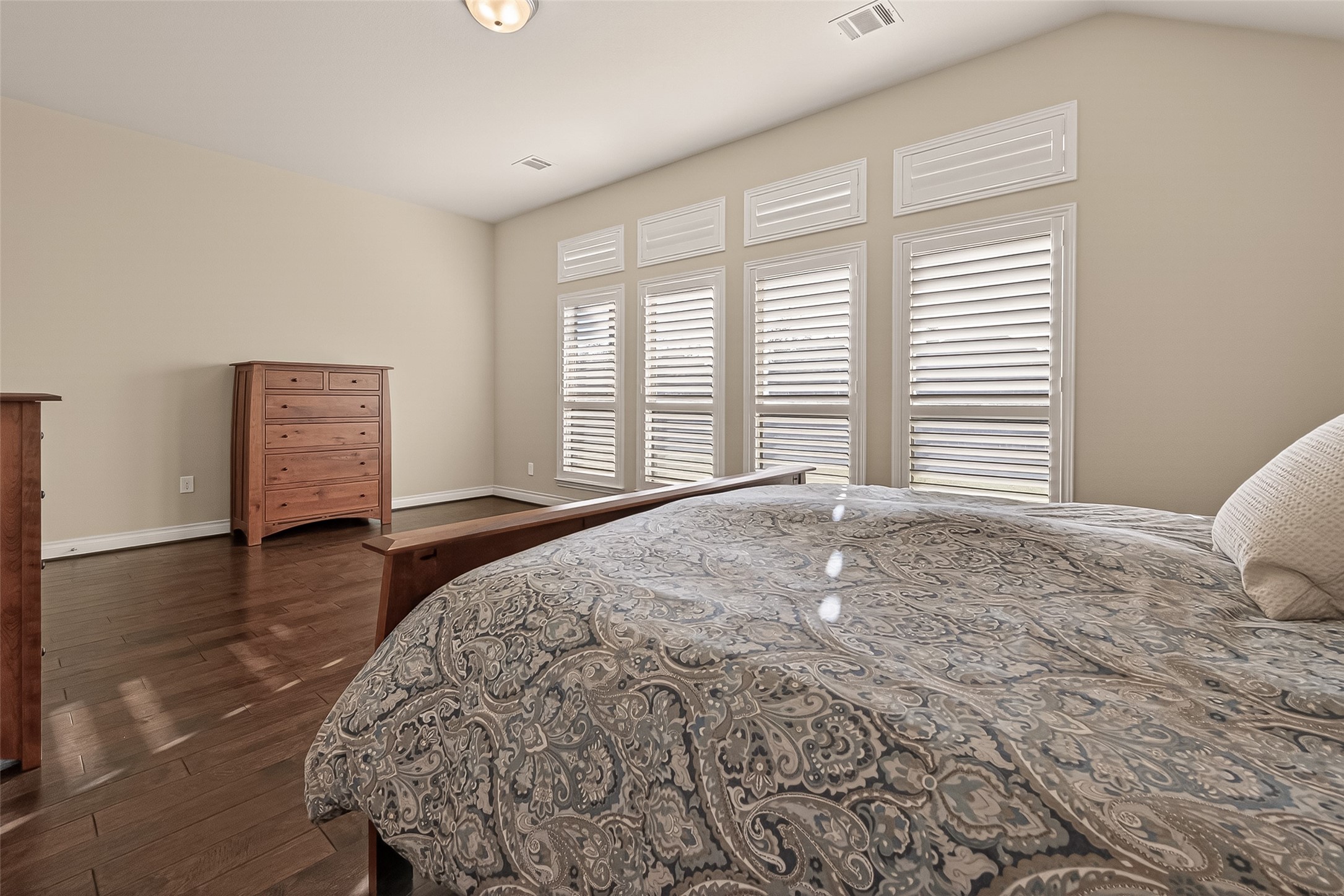 28435 Sycamore Falls Lane Fulshear, TX 77441 - Photo 38 of 46 a view of a bedroom with a bed and wooden floor