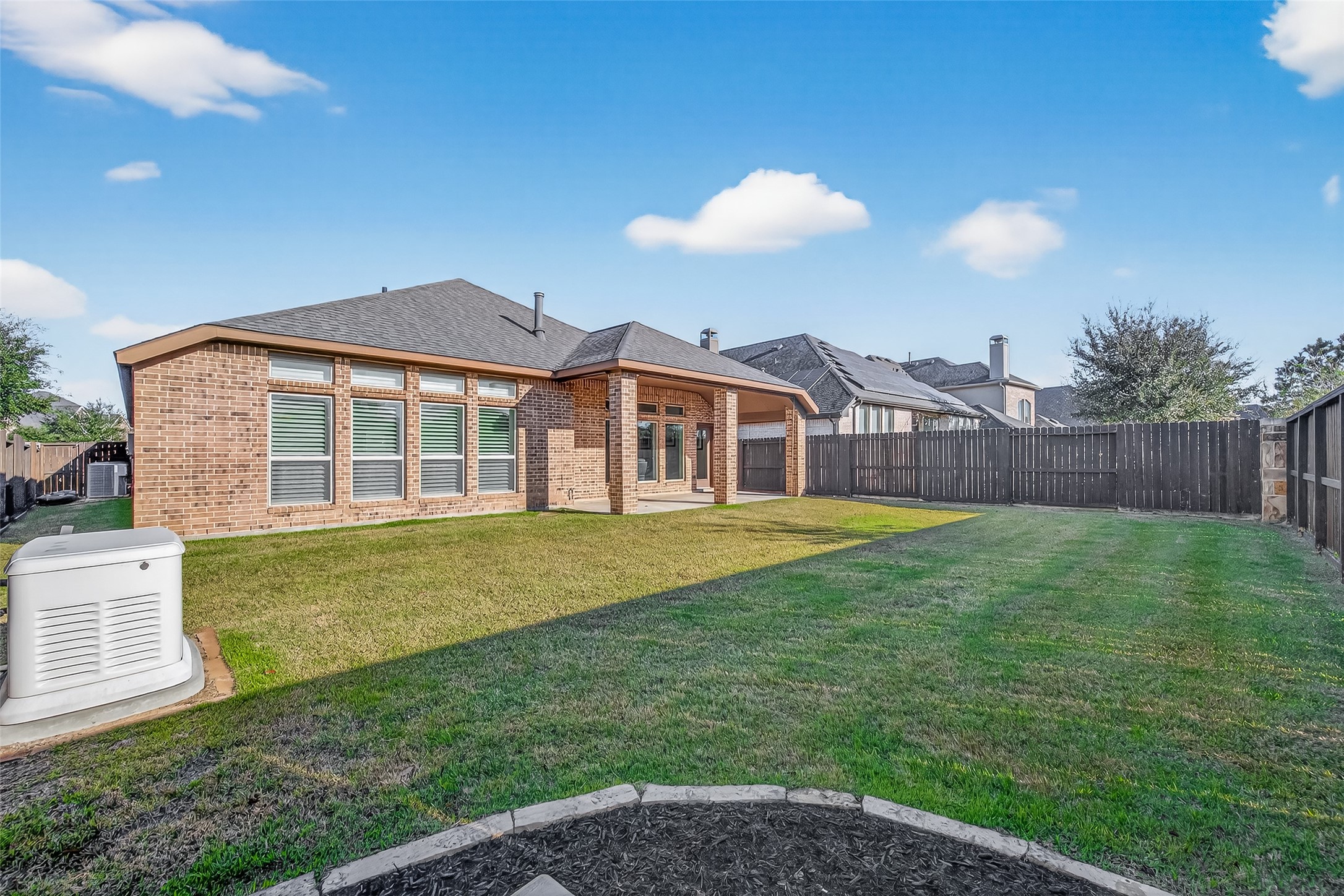 28435 Sycamore Falls Lane Fulshear, TX 77441 - Photo 45 of 46 a view of a house with a backyard
