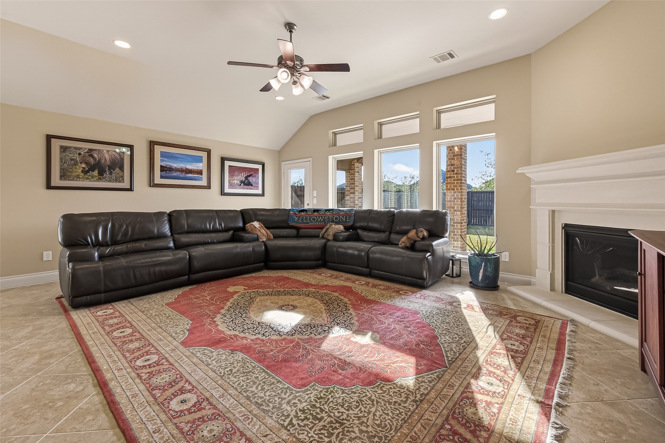 28435 Sycamore Falls Lane Fulshear, TX 77441 - Photo 7 of 46 a living room with furniture or couch and a fireplace
