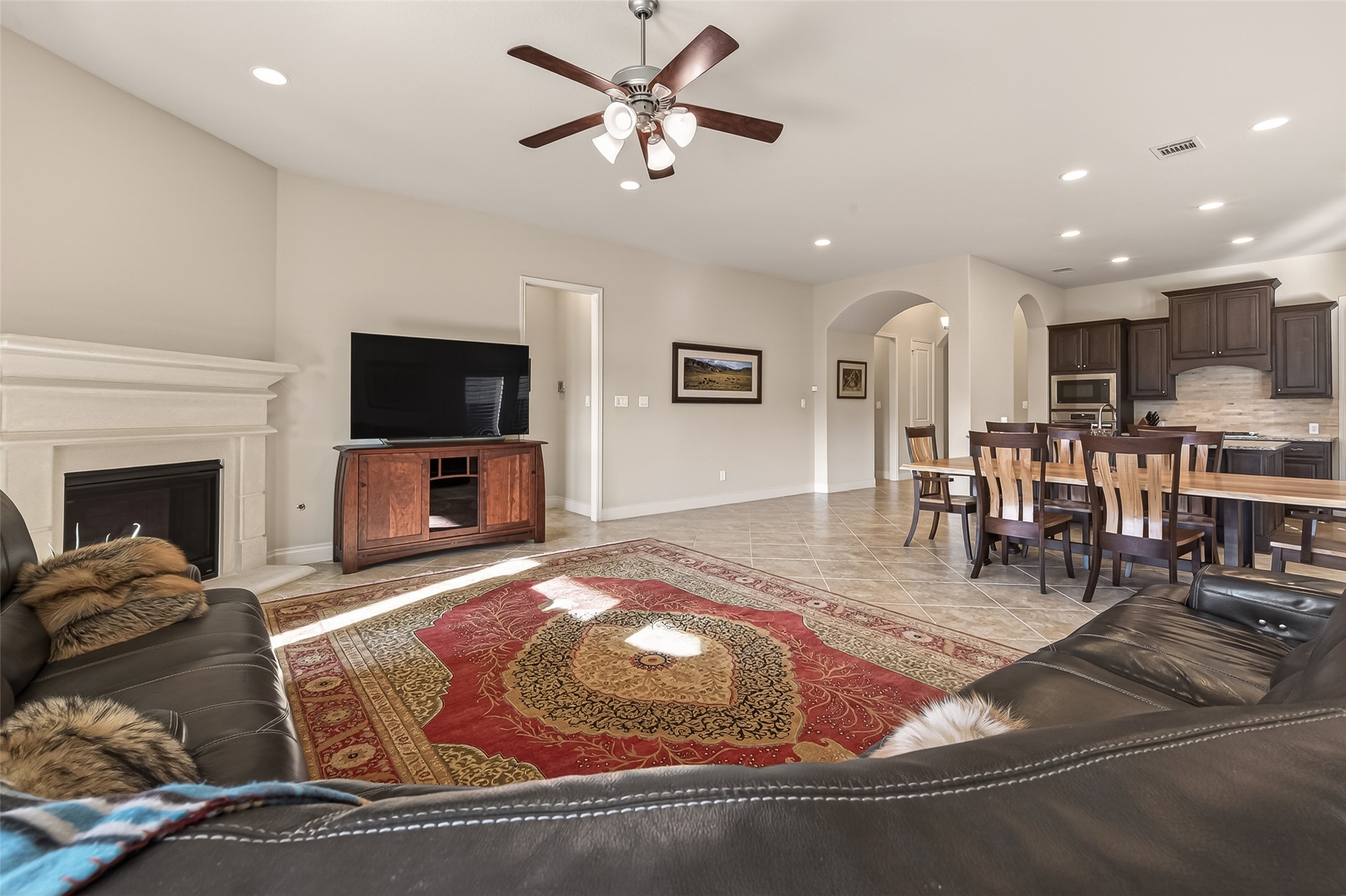 28435 Sycamore Falls Lane Fulshear, TX 77441 - Photo 9 of 46 a living room with furniture and a flat screen tv