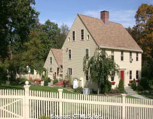 153 Burnt Hill Road Hebron, CT 06248 - Photo 1 of 1 a front view of a house with a garden