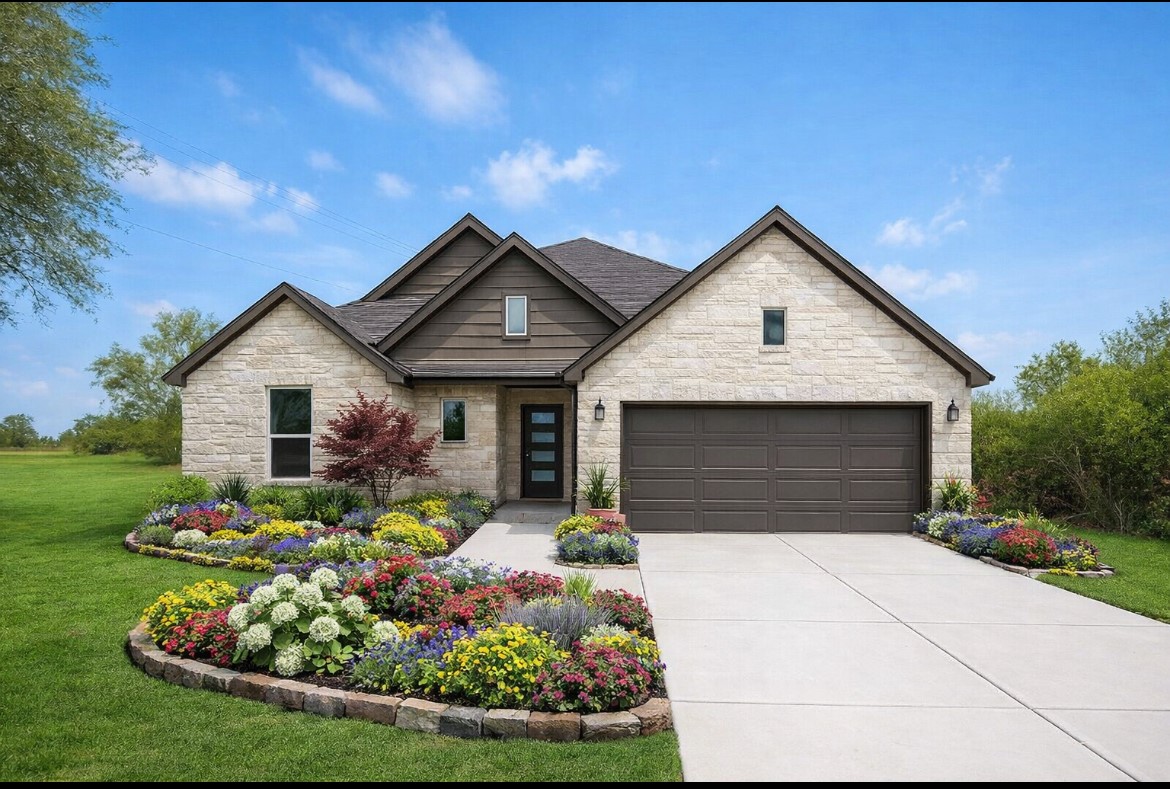 a front view of a house with garden