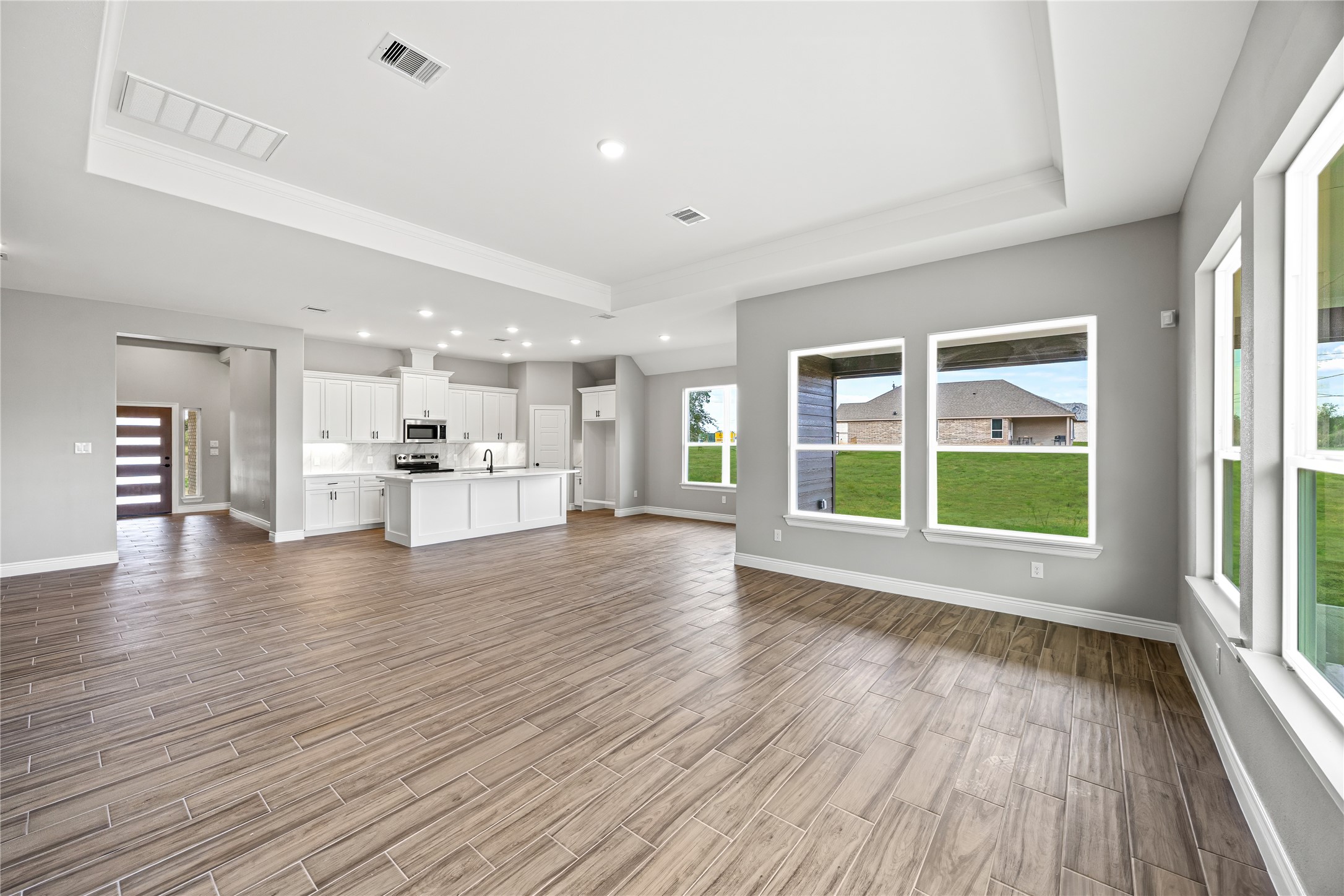 513 Oleander Street Waller, TX 77484 - Photo 12 of 28 a view of kitchen with furniture and wooden floor