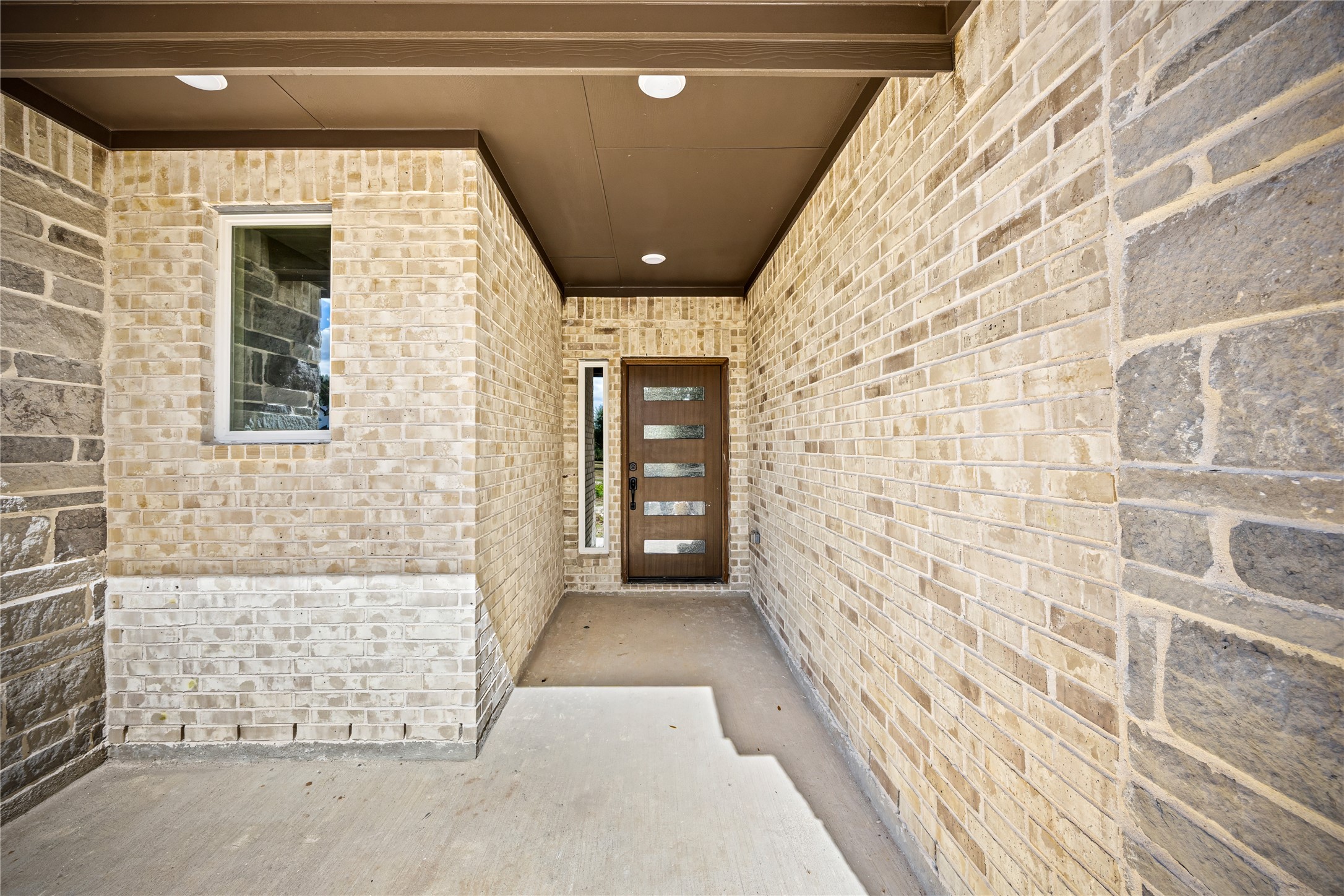 513 Oleander Street Waller, TX 77484 - Photo 3 of 28 a view of entryway with a hallway