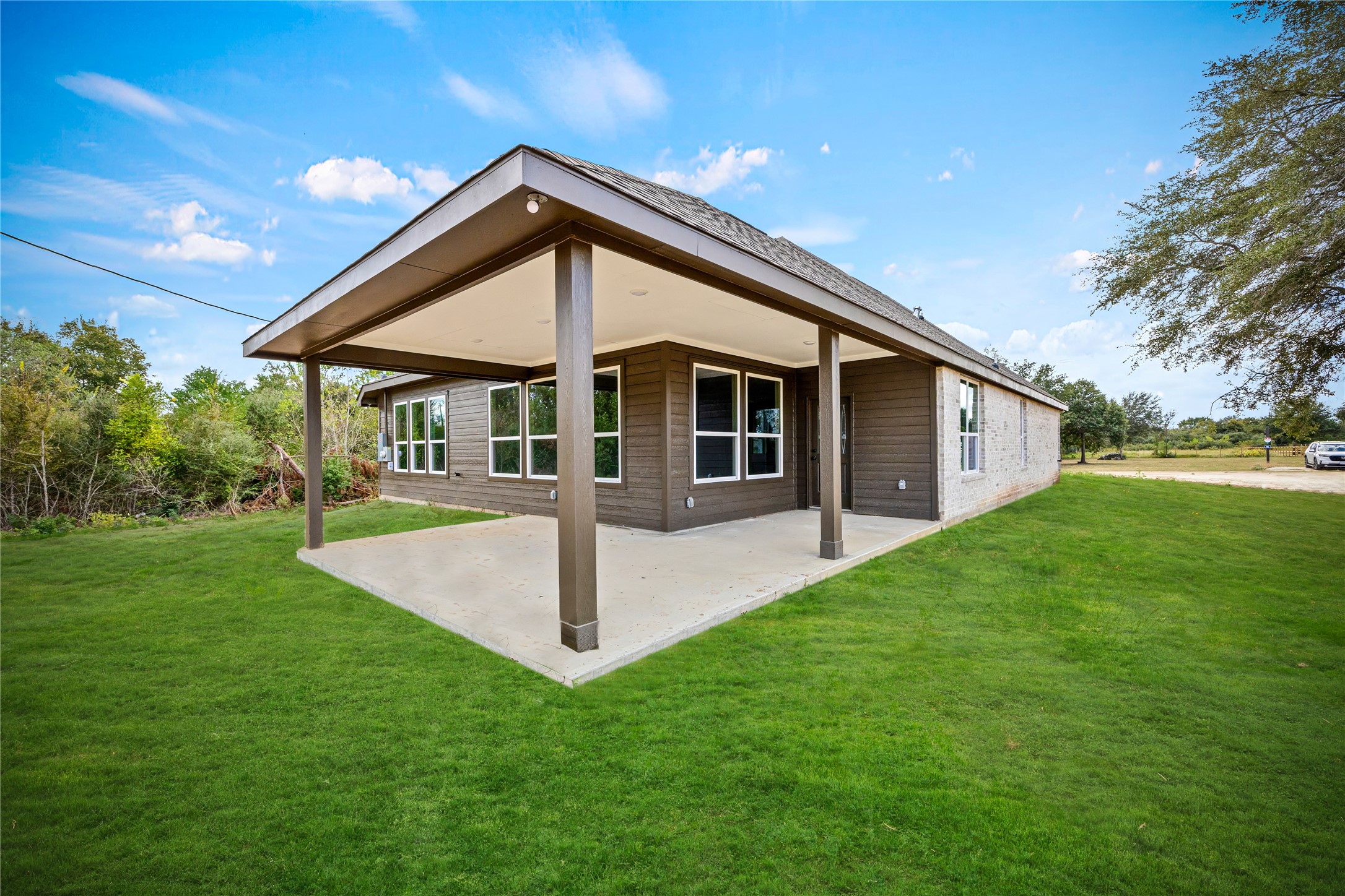 513 Oleander Street Waller, TX 77484 - Photo 4 of 28 a front view of house with a garden