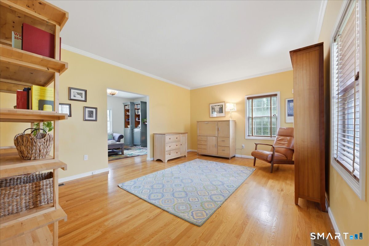 99 Sleepy Hollow Road East Lyme, CT 06357 - Photo 14 of 40 Formal living off the family room offers flexible space.