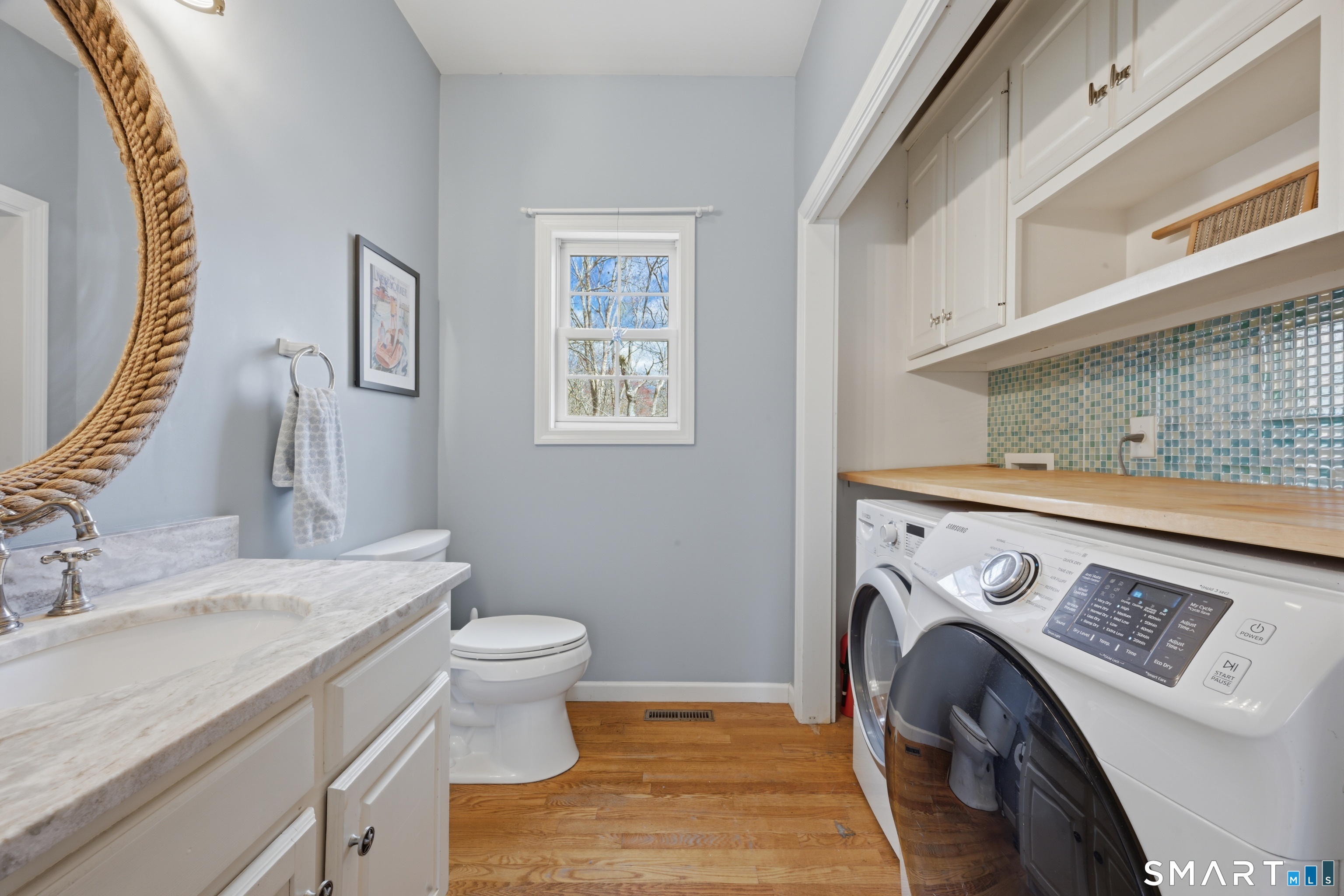 99 Sleepy Hollow Road East Lyme, CT 06357 - Photo 15 of 40 Half bath and laundry located on the main floor.