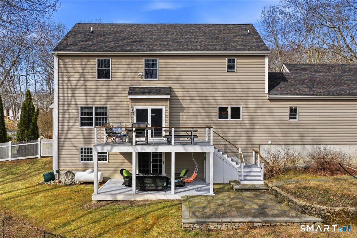 99 Sleepy Hollow Road East Lyme, CT 06357 - Photo 31 of 40 Deck, covered patio and bluestone patio offer multiple areas for entertaining or quiet moments.
