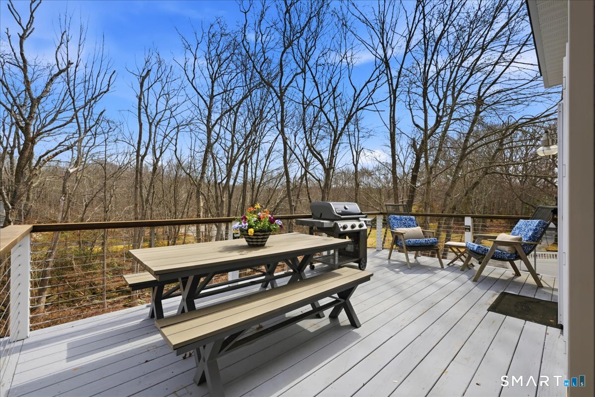 99 Sleepy Hollow Road East Lyme, CT 06357 - Photo 32 of 40 Low maintenance composite decking and cable railing system for an updated, open feel.