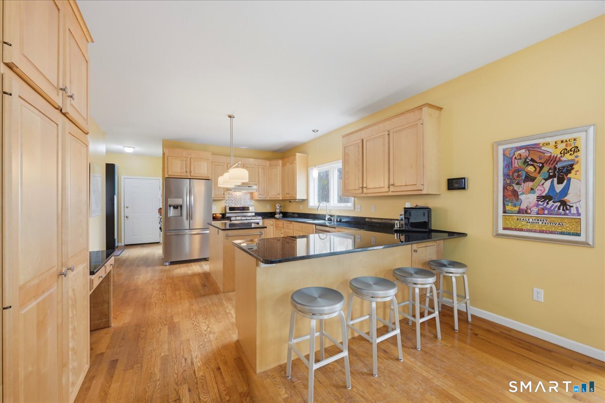 99 Sleepy Hollow Road East Lyme, CT 06357 - Photo 6 of 40 Extra seating space at kitchen peninsula.