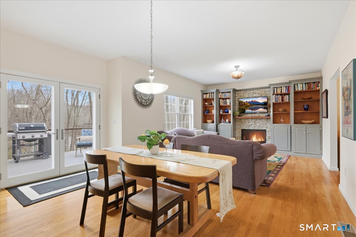 99 Sleepy Hollow Road East Lyme, CT 06357 - Photo 8 of 40 Kitchen space opens to family room and french doors to deck.