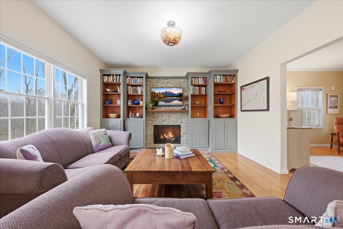 99 Sleepy Hollow Road East Lyme, CT 06357 - Photo 9 of 40 A perfect gathering spot in front of the gas fireplace.