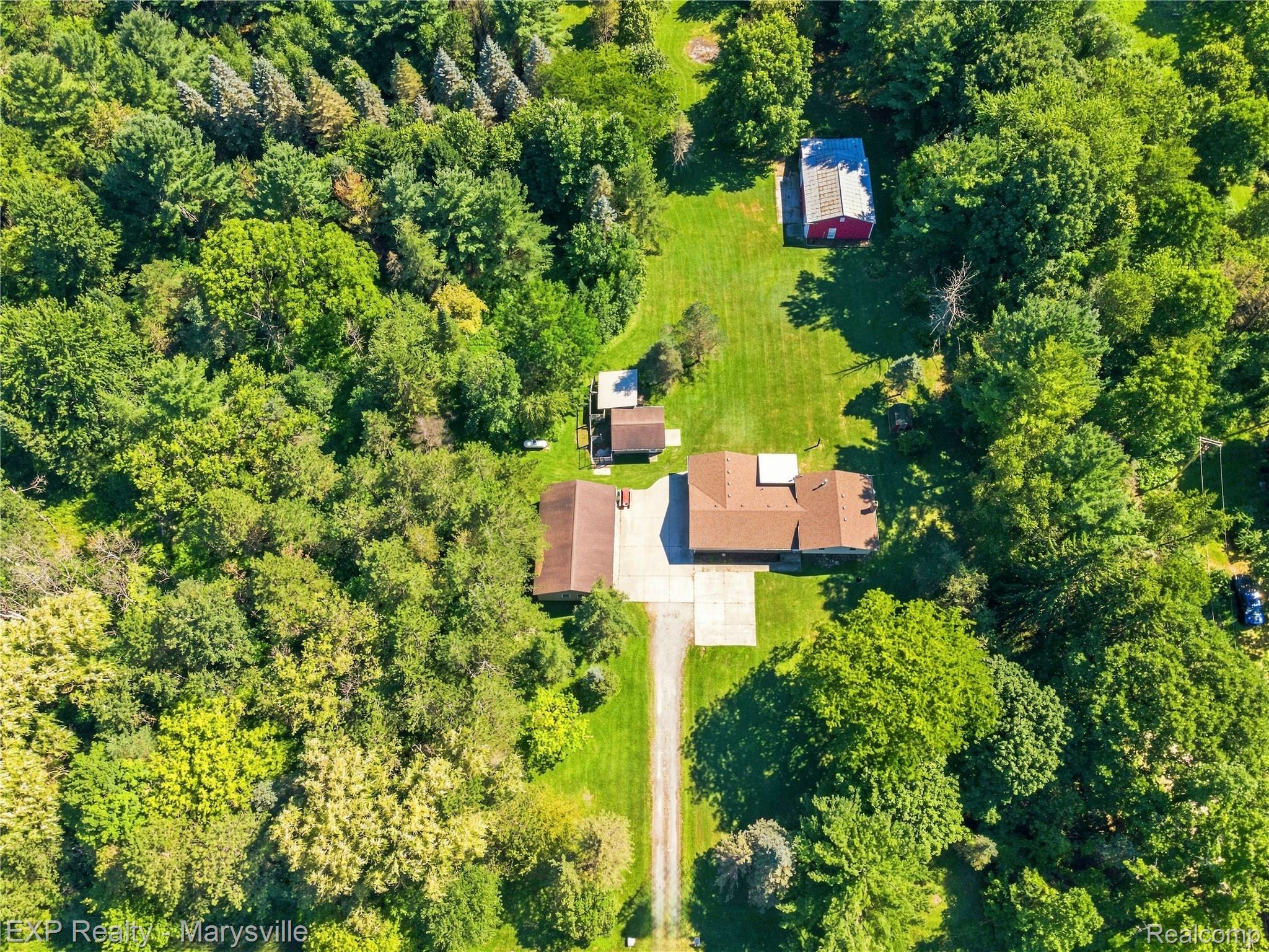13739 Yale Road Yale, MI 48097 - Photo 50 of 50 Expansive lot featuring a main residence, secondary building, mature trees, and a concrete driveway