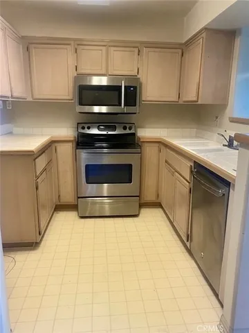 a kitchen with a sink and a microwave