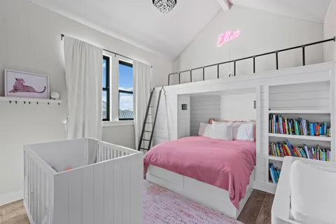 a bedroom with a bed and a book shelf