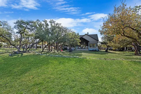 a view of a house with a big yard