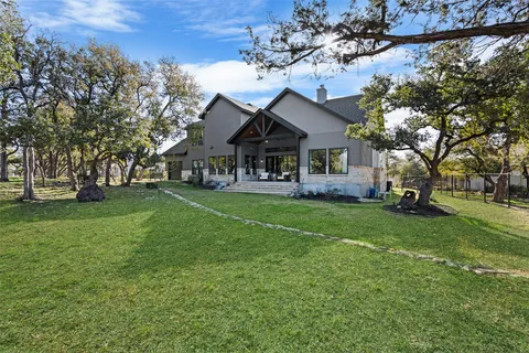 a front view of house with yard and green space