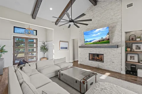 a living room with furniture and a fireplace