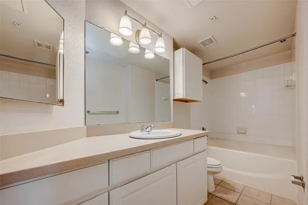 a bathroom with a sink vanity and a mirror