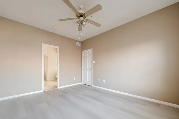 a large bathroom with a sink and a mirror