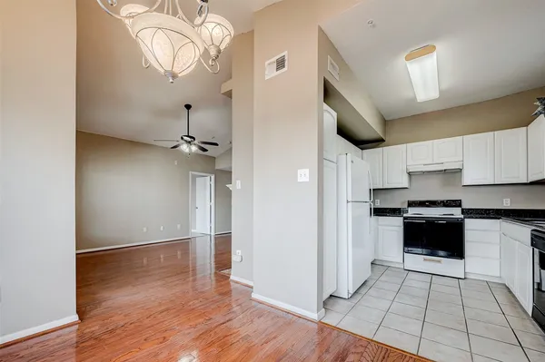a kitchen with a sink stainless steel appliances and cabinets