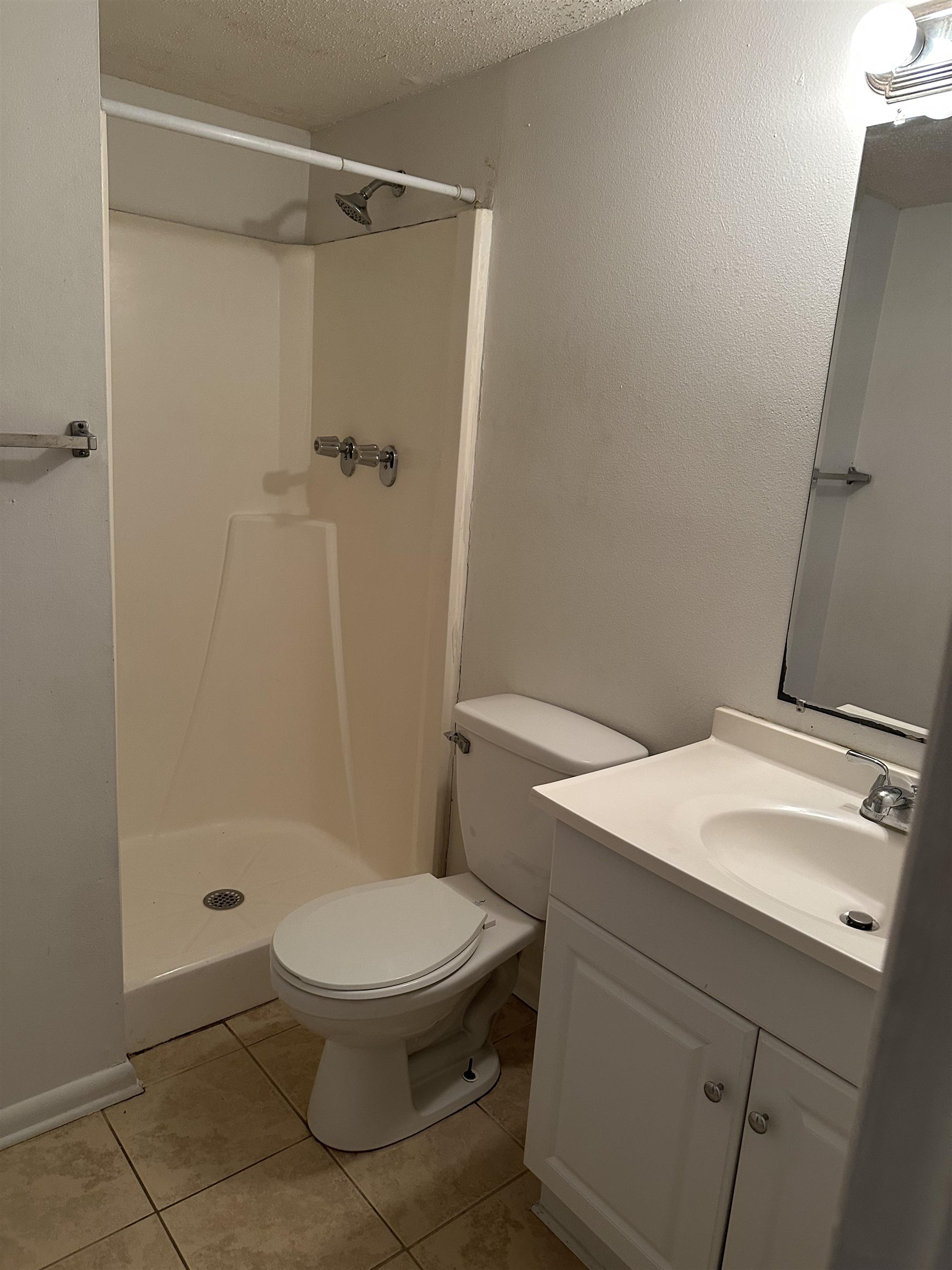 3555 Highway 544, Unit 18G Conway, SC 29526 - Photo 5 of 11 Full bath featuring vanity, a stall shower, a textured ceiling, and light tile patterned flooring