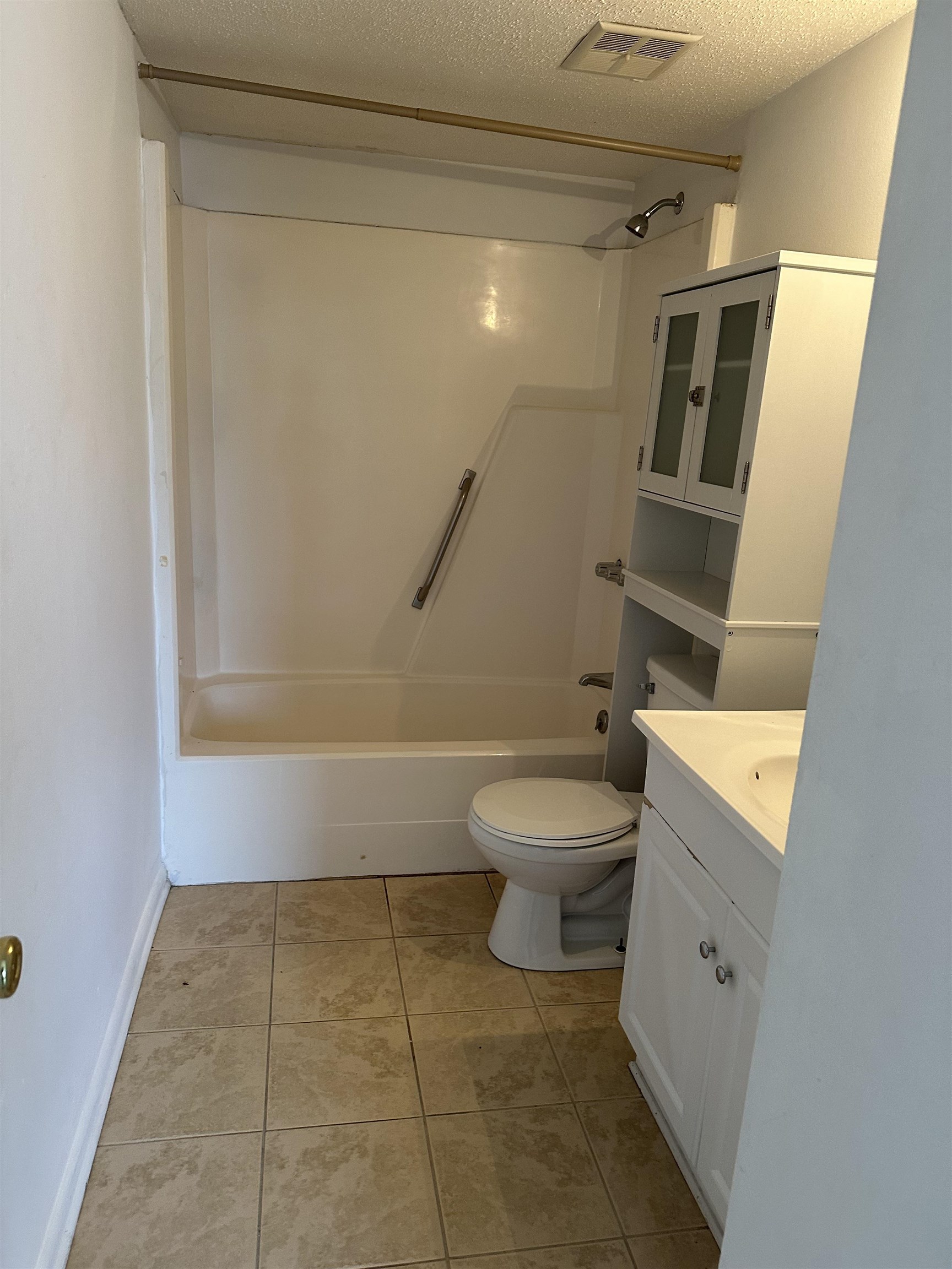 3555 Highway 544, Unit 18G Conway, SC 29526 - Photo 9 of 11 Full bath with vanity, shower combination, a textured ceiling, and light tile patterned floors