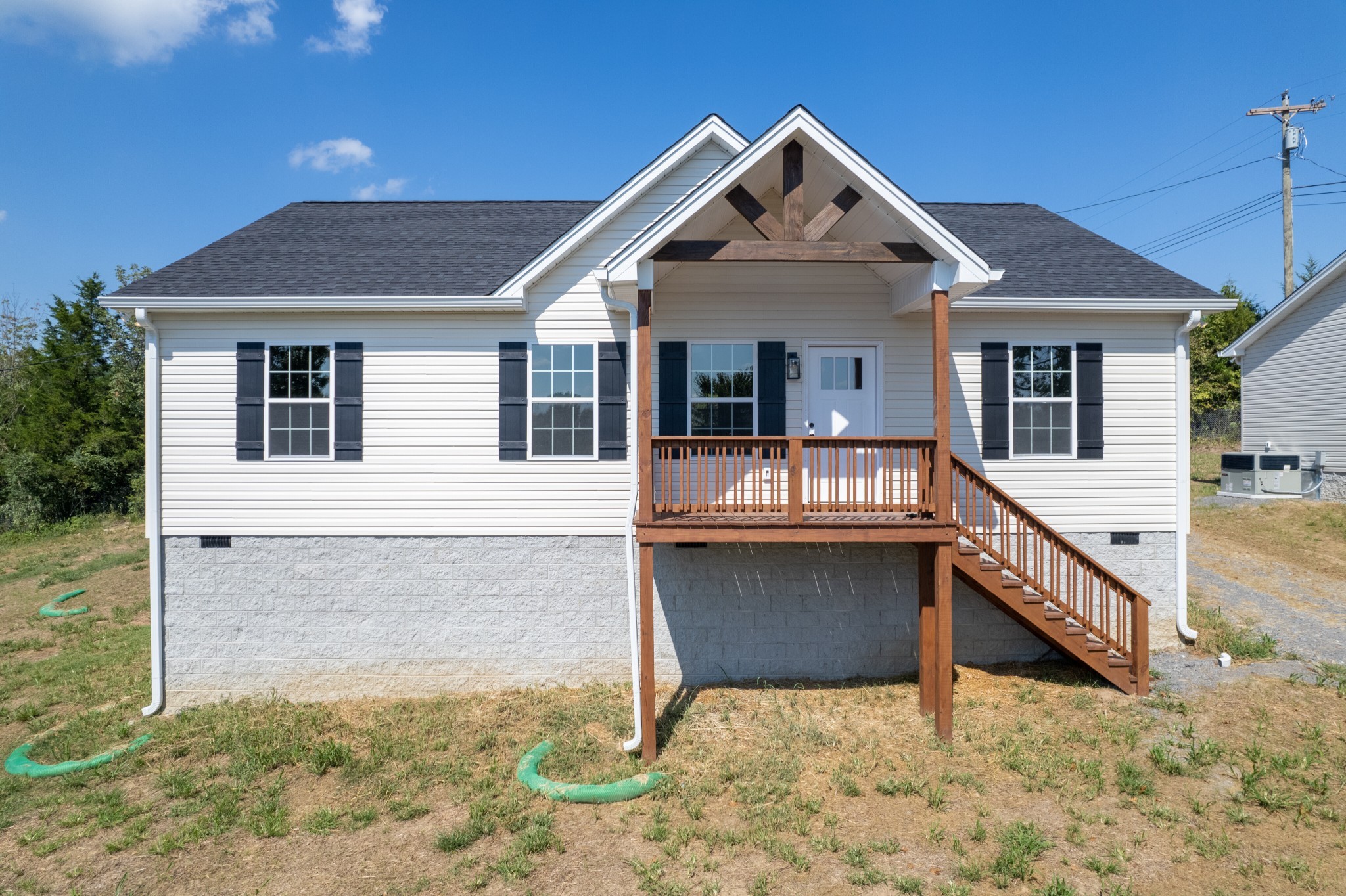 125 Vivian Lane Carthage, TN 37030 - Photo 1 of 30 a front view of a house with glass windows and yard