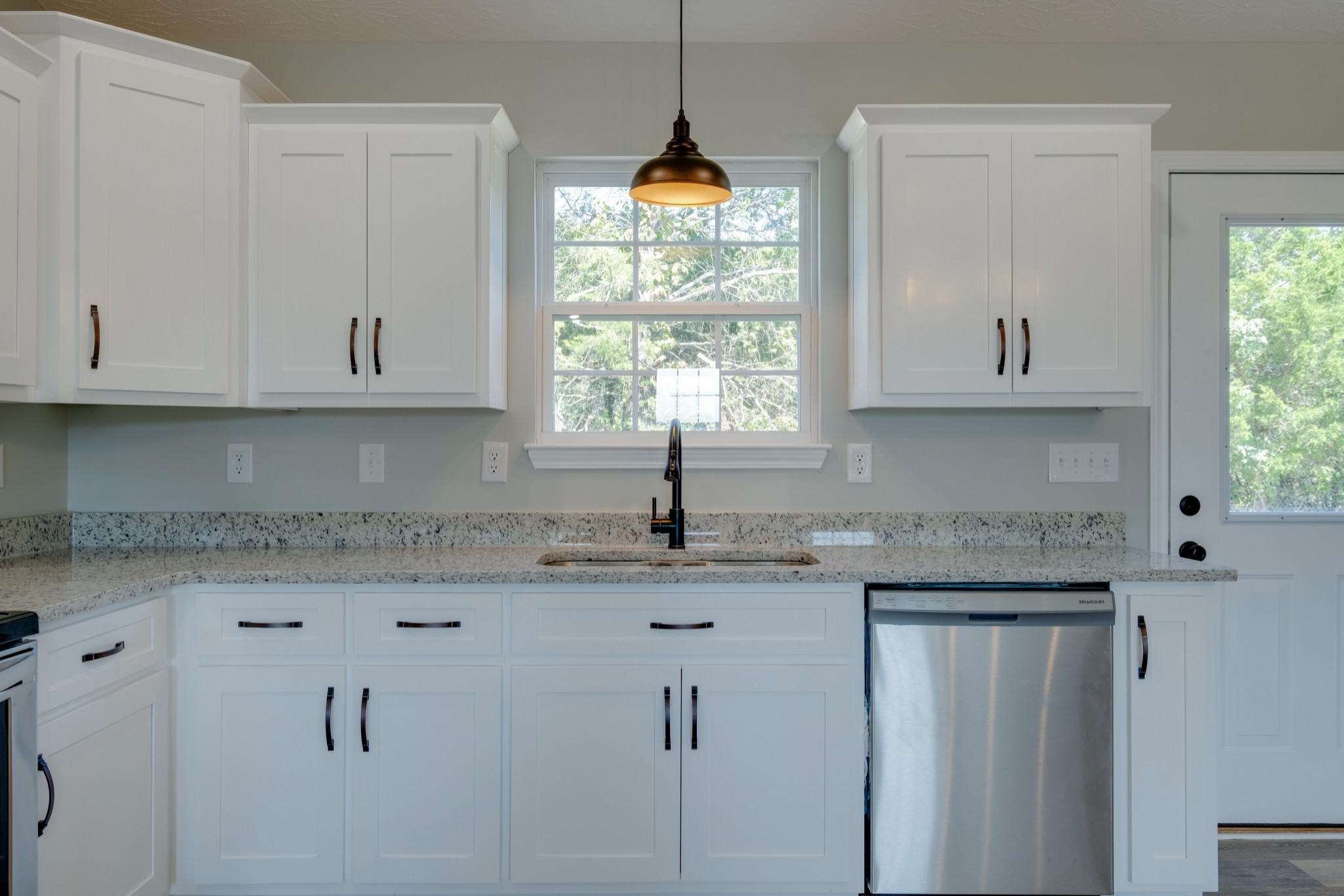 125 Vivian Lane Carthage, TN 37030 - Photo 11 of 30 a kitchen with granite countertop white cabinets and window