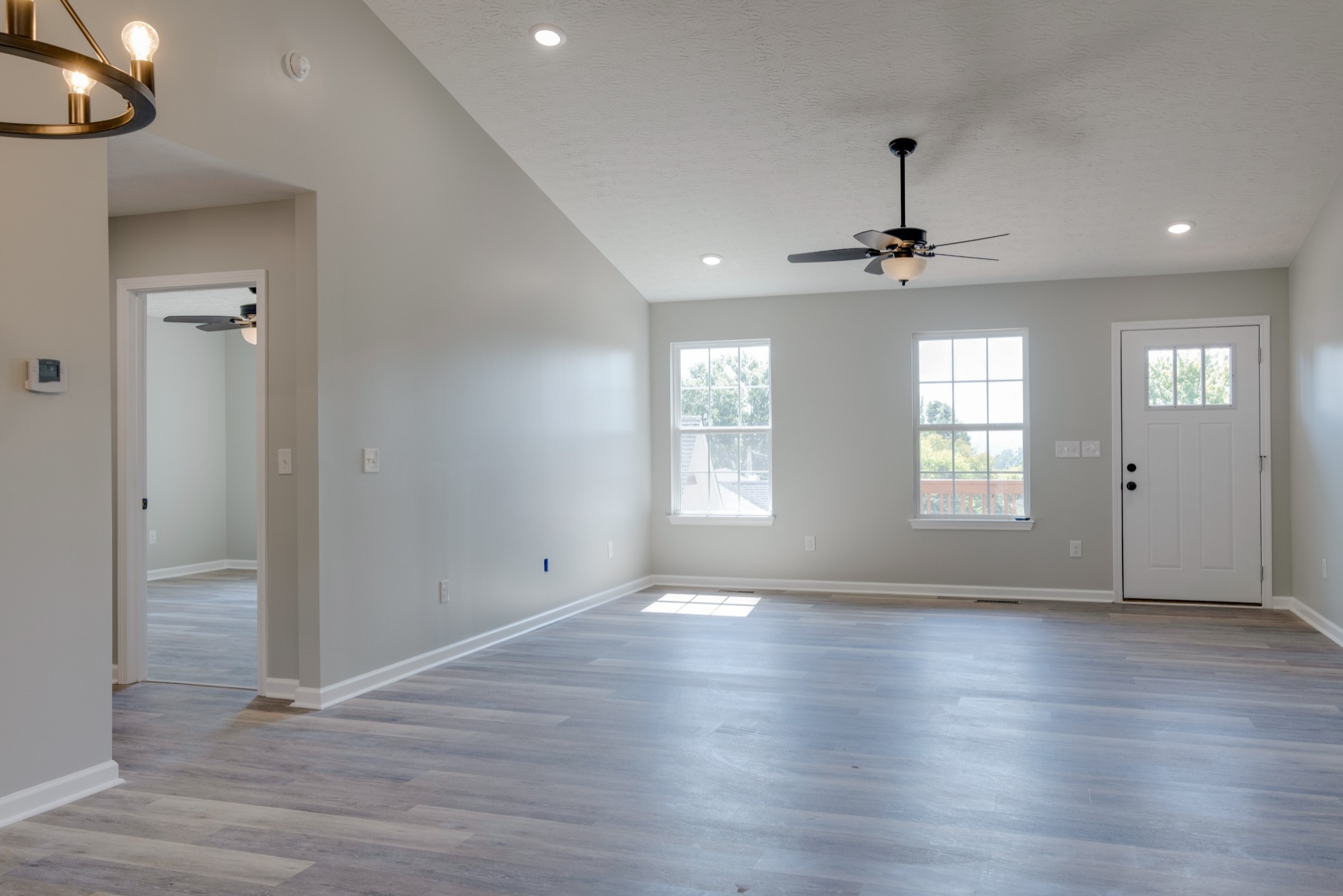 125 Vivian Lane Carthage, TN 37030 - Photo 13 of 30 an empty room with wooden floor and windows