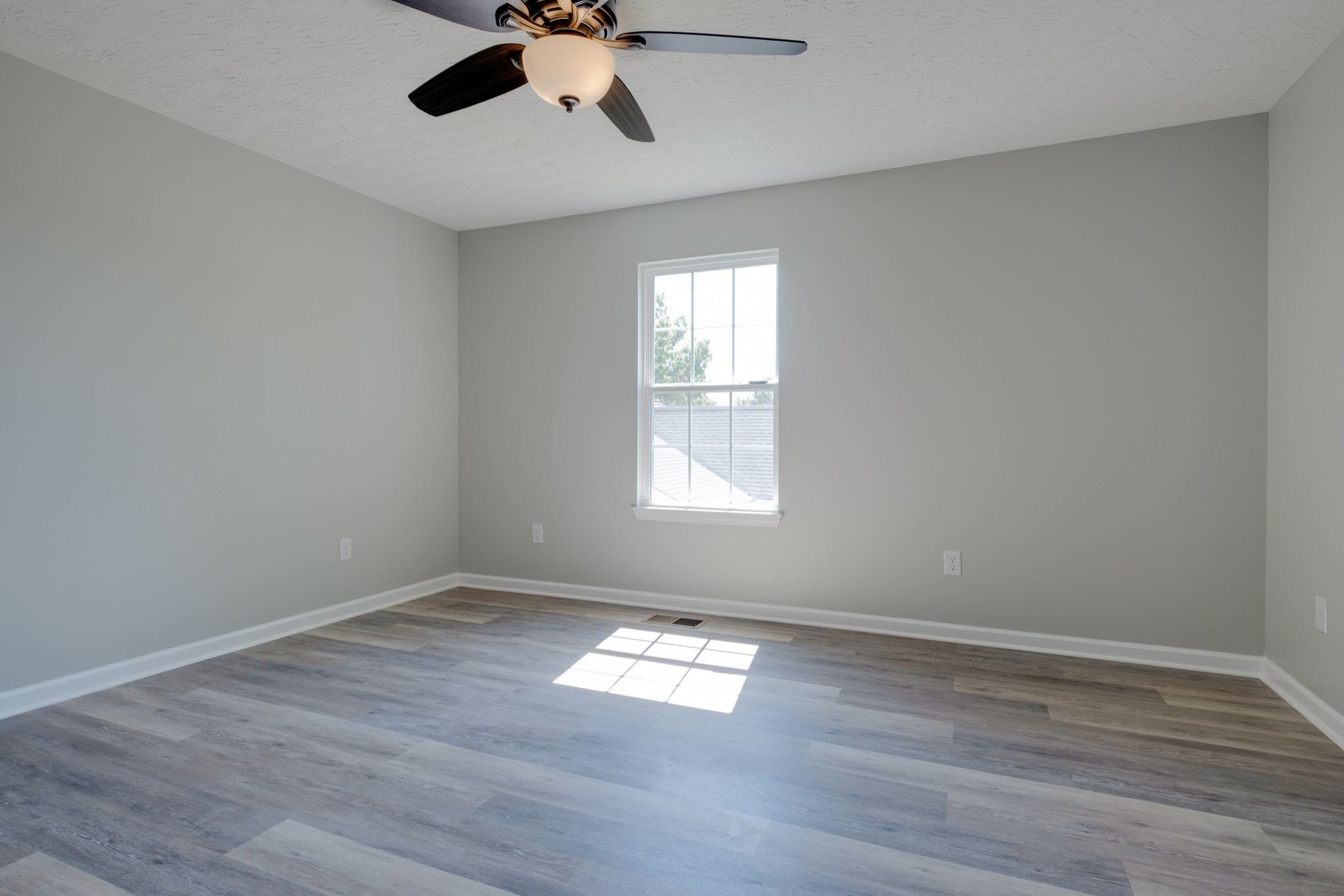 125 Vivian Lane Carthage, TN 37030 - Photo 15 of 30 a view of empty room with wooden floor and fan