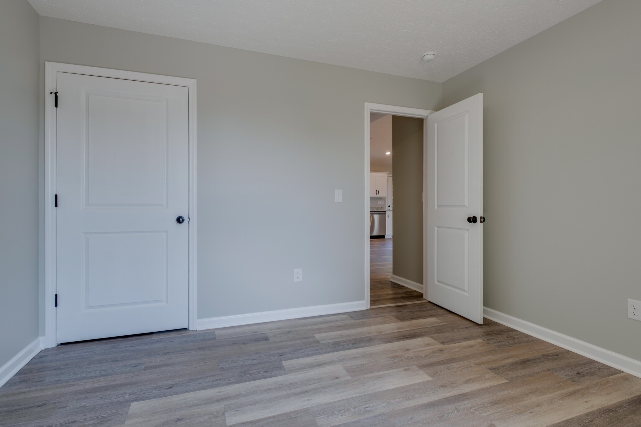 125 Vivian Lane Carthage, TN 37030 - Photo 22 of 30 a view of an empty room with wooden floor