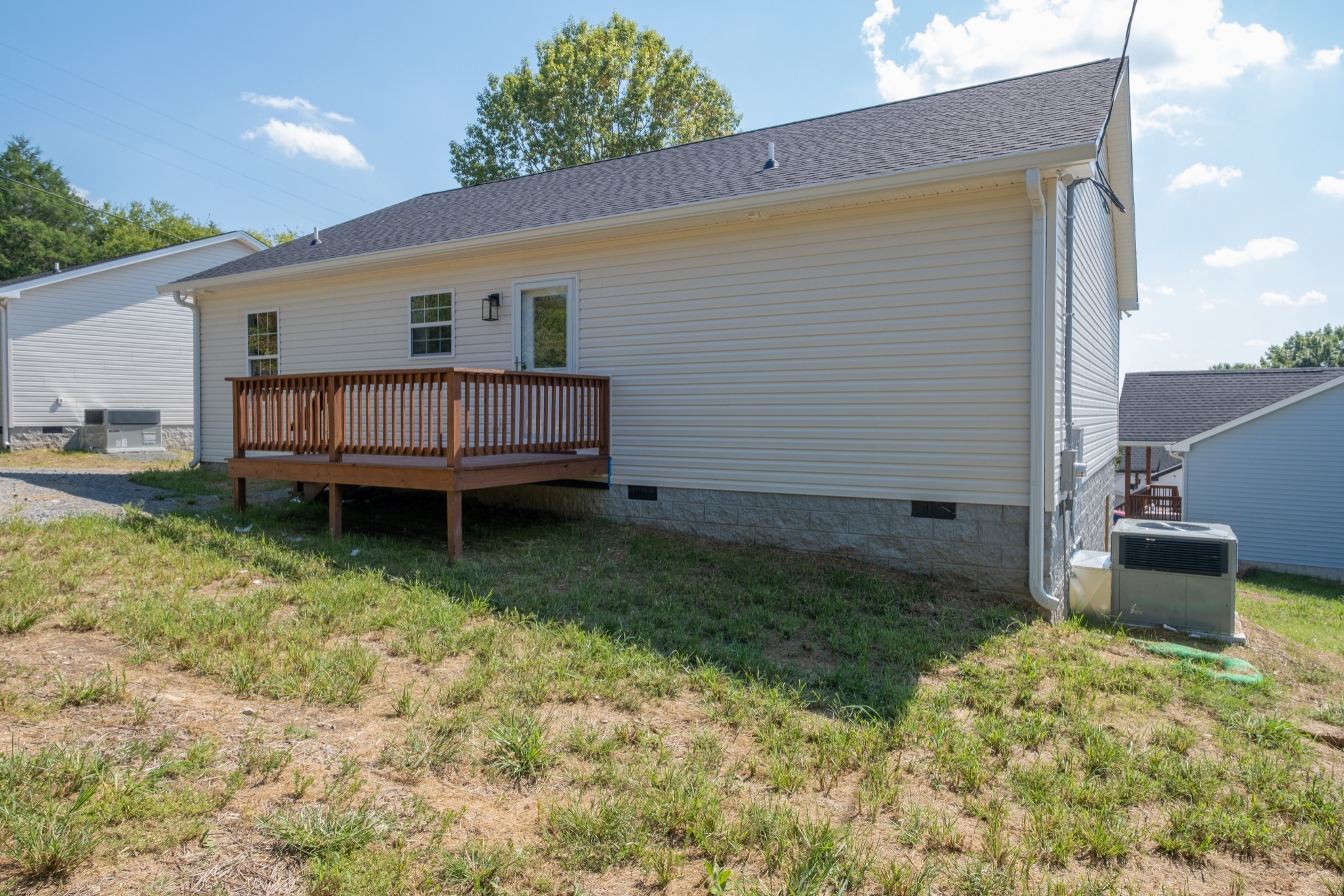 125 Vivian Lane Carthage, TN 37030 - Photo 29 of 30 a backyard of a house with barbeque oven and wooden fence