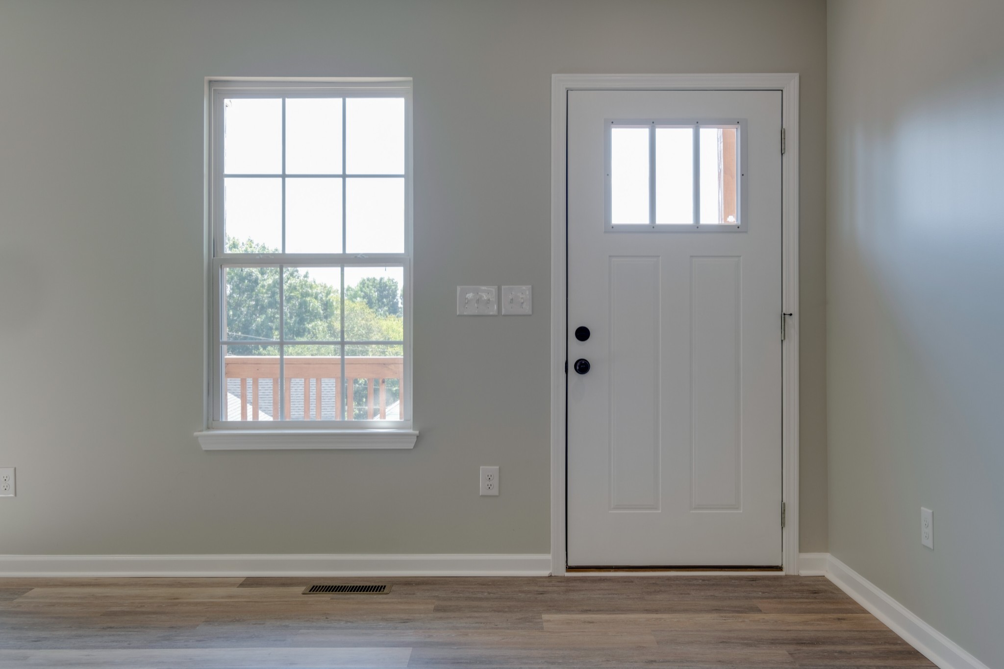 125 Vivian Lane Carthage, TN 37030 - Photo 5 of 30 an empty room with wooden floor and windows