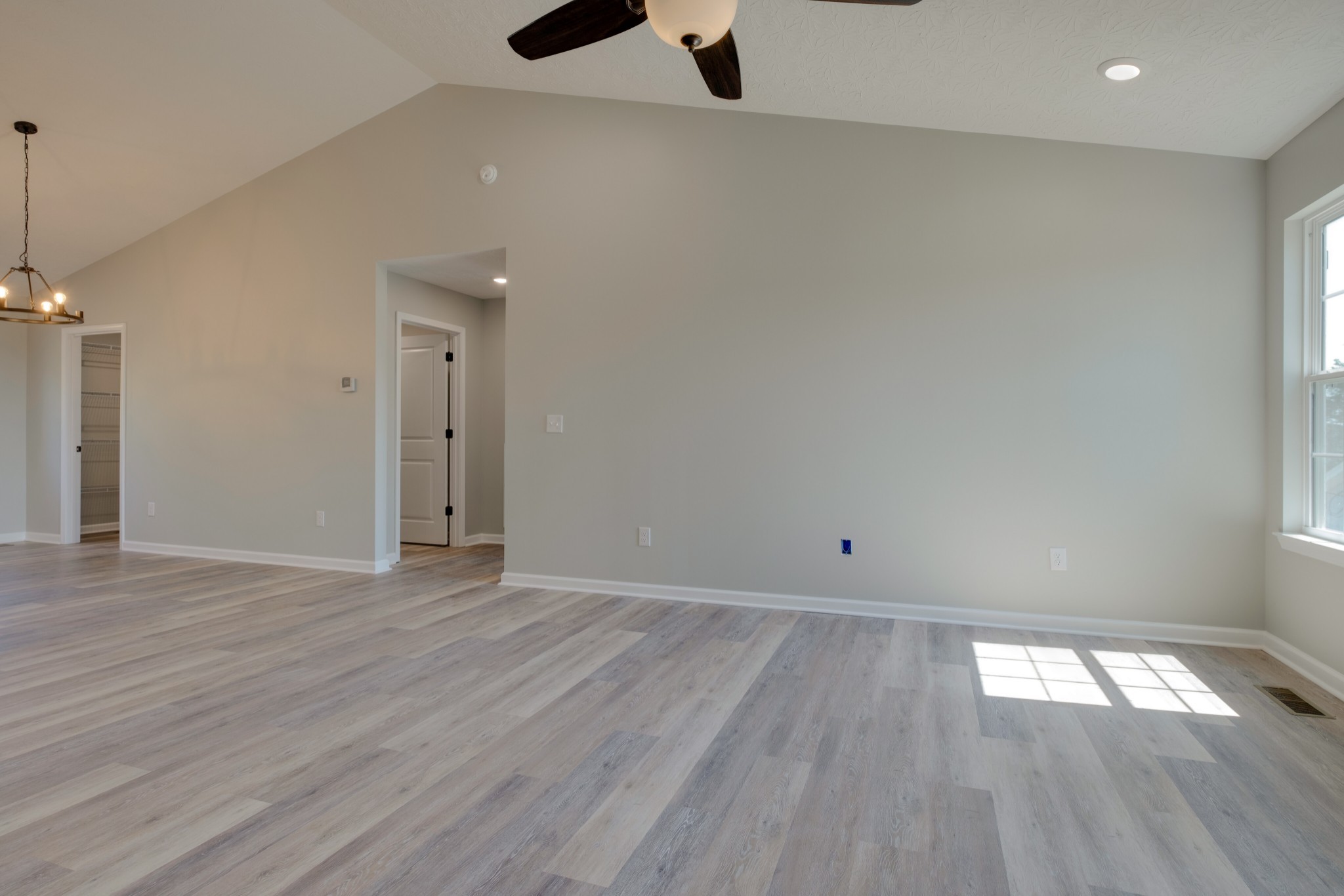125 Vivian Lane Carthage, TN 37030 - Photo 7 of 30 an empty room with wooden floor and windows