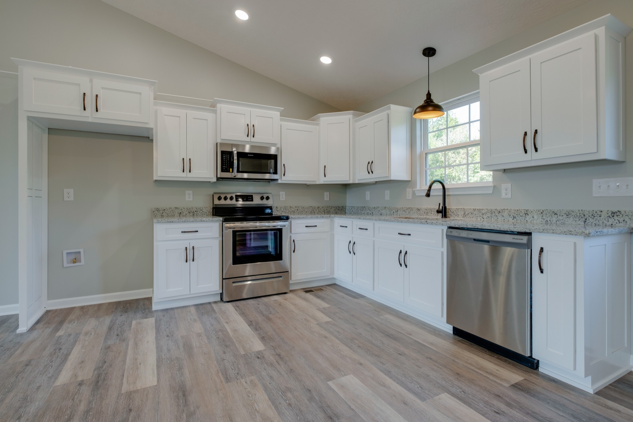 125 Vivian Lane Carthage, TN 37030 - Photo 10 of 30 a kitchen with granite countertop a sink cabinets and stainless steel appliances