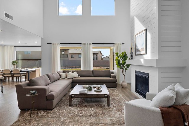 382 North Rhyolite Drive, Unit 111 Hurricane, UT 84737 - Photo 7 of 37 Living area featuring soaring ceilings and wood-finish flooring