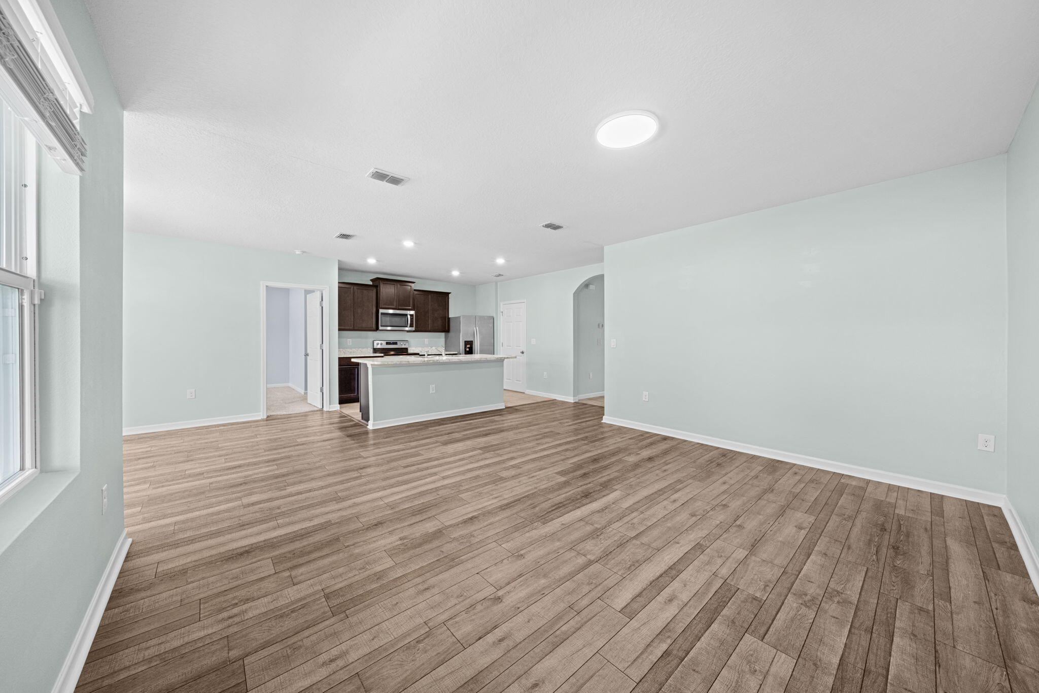 820 Forest Trace Circle Titusville, FL 32780 - Photo 11 of 27 a view of kitchen with microwave and cabinets
