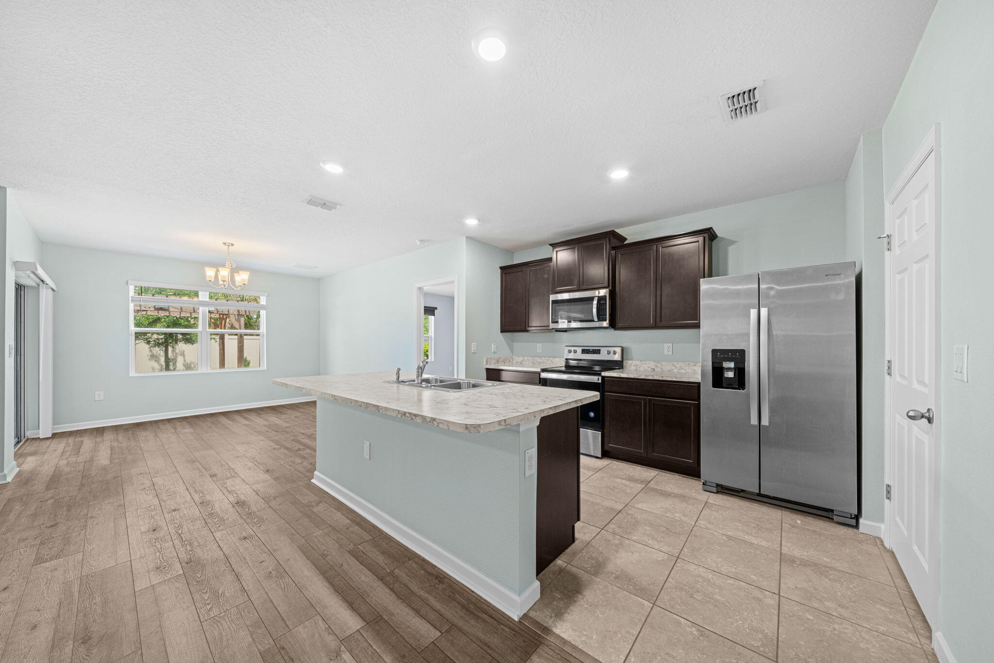 820 Forest Trace Circle Titusville, FL 32780 - Photo 12 of 27 a kitchen with stainless steel appliances granite countertop a refrigerator and a sink