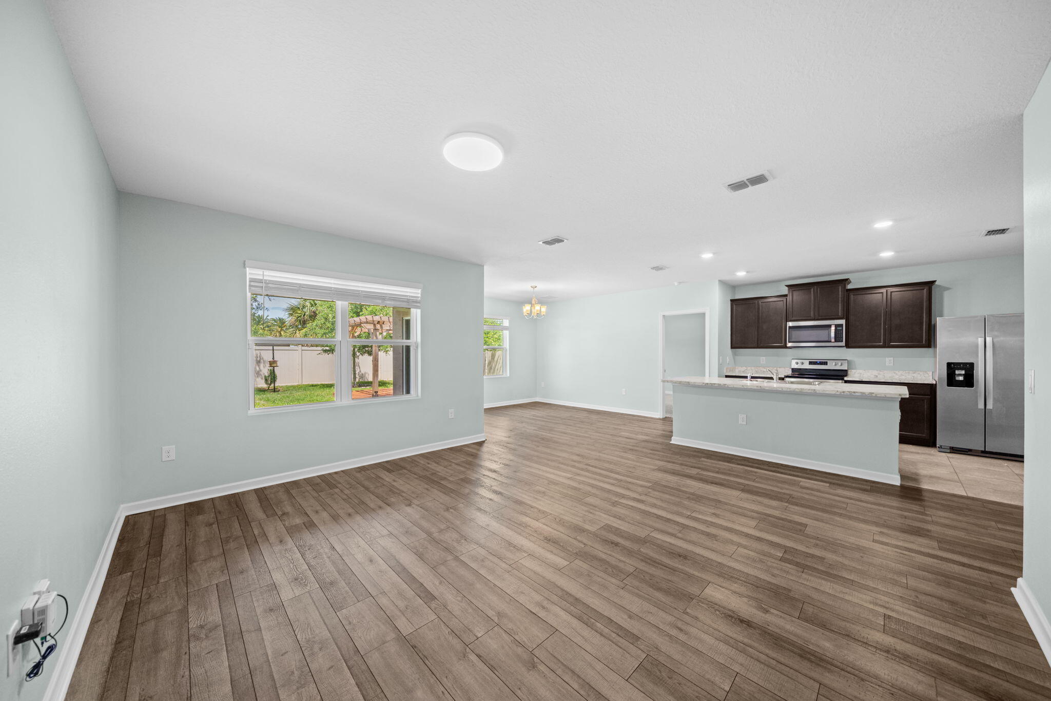 820 Forest Trace Circle Titusville, FL 32780 - Photo 13 of 27 a view of kitchen with microwave and refrigerator