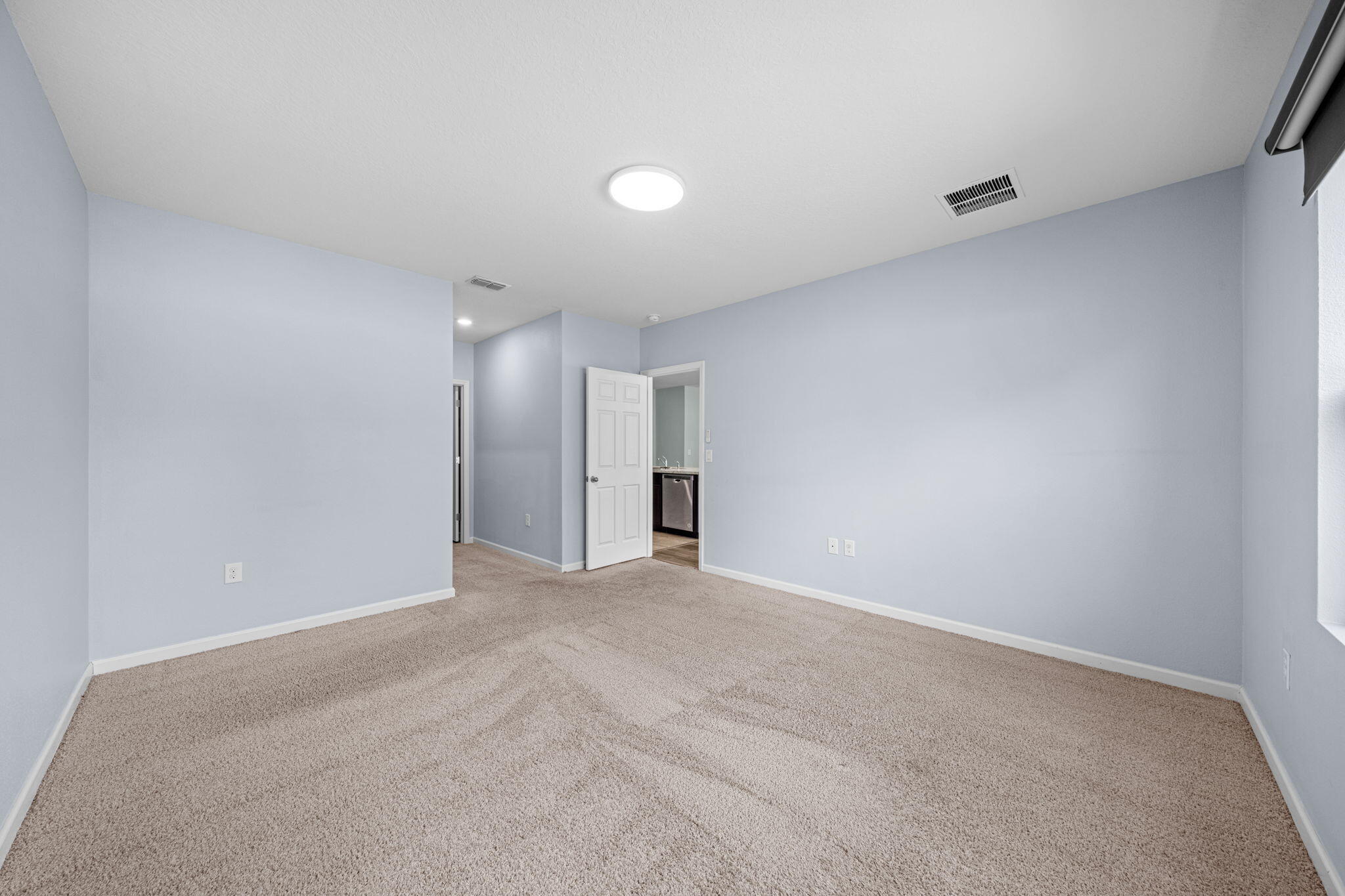 820 Forest Trace Circle Titusville, FL 32780 - Photo 17 of 27 a view of an empty room with a kitchen