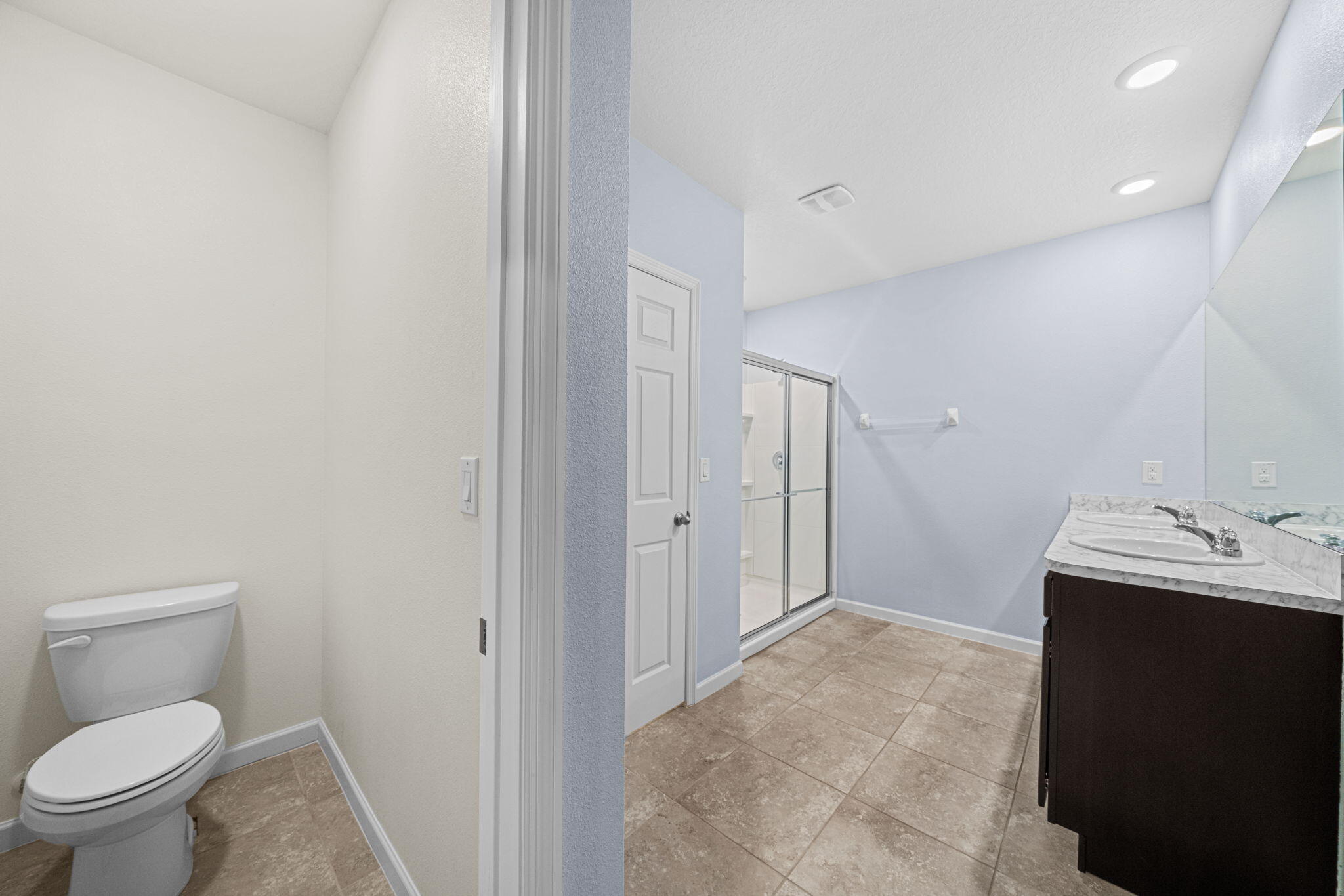 820 Forest Trace Circle Titusville, FL 32780 - Photo 18 of 27 a bathroom with a sink toilet and vanity