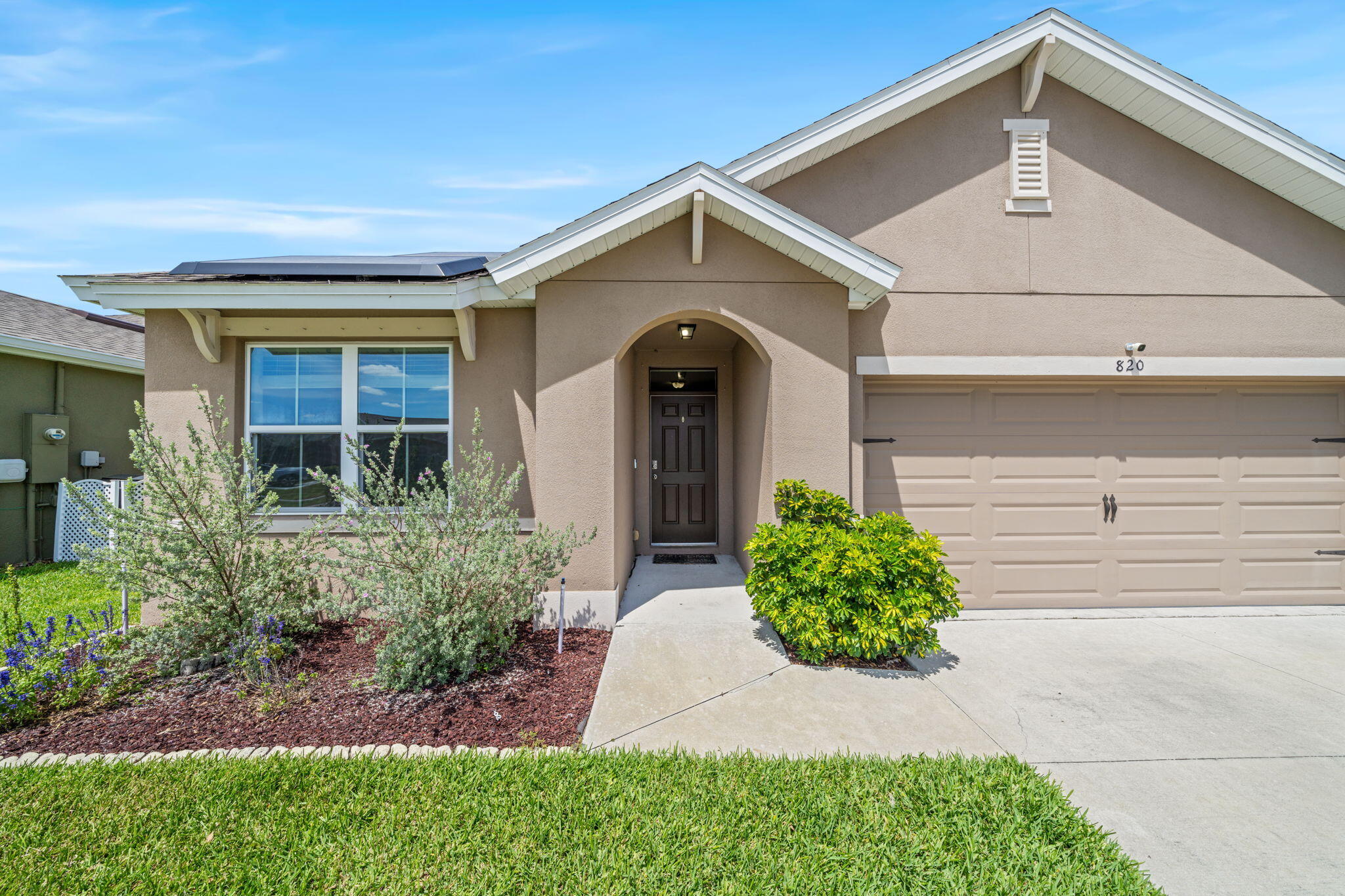 820 Forest Trace Circle Titusville, FL 32780 - Photo 2 of 27 a front view of a house with garden
