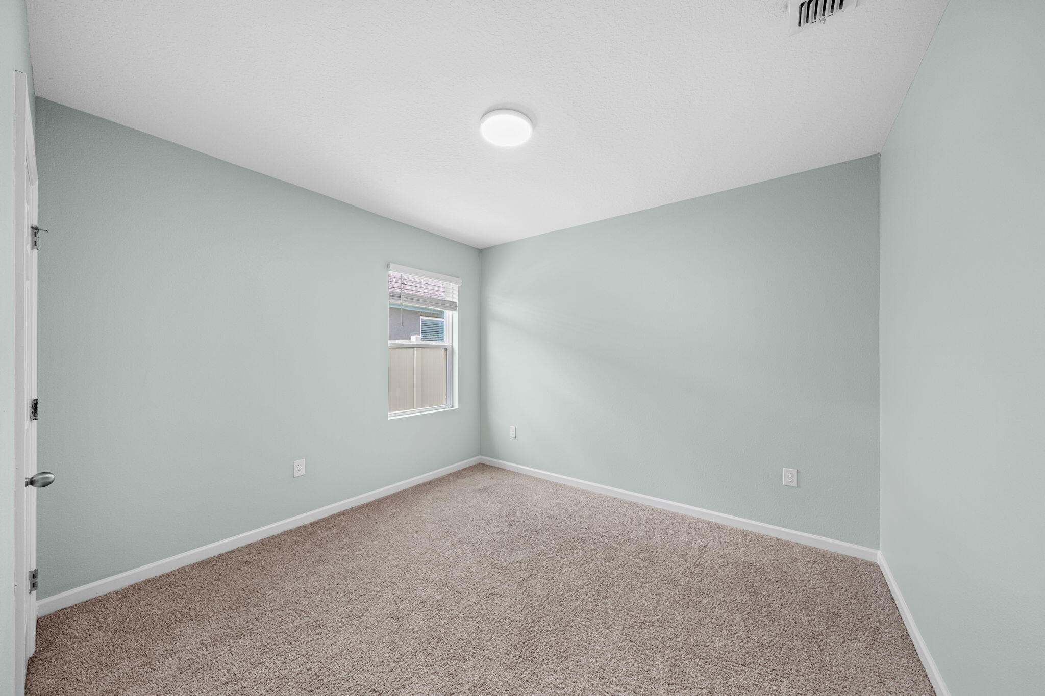 820 Forest Trace Circle Titusville, FL 32780 - Photo 23 of 27 a view of an empty room with a window