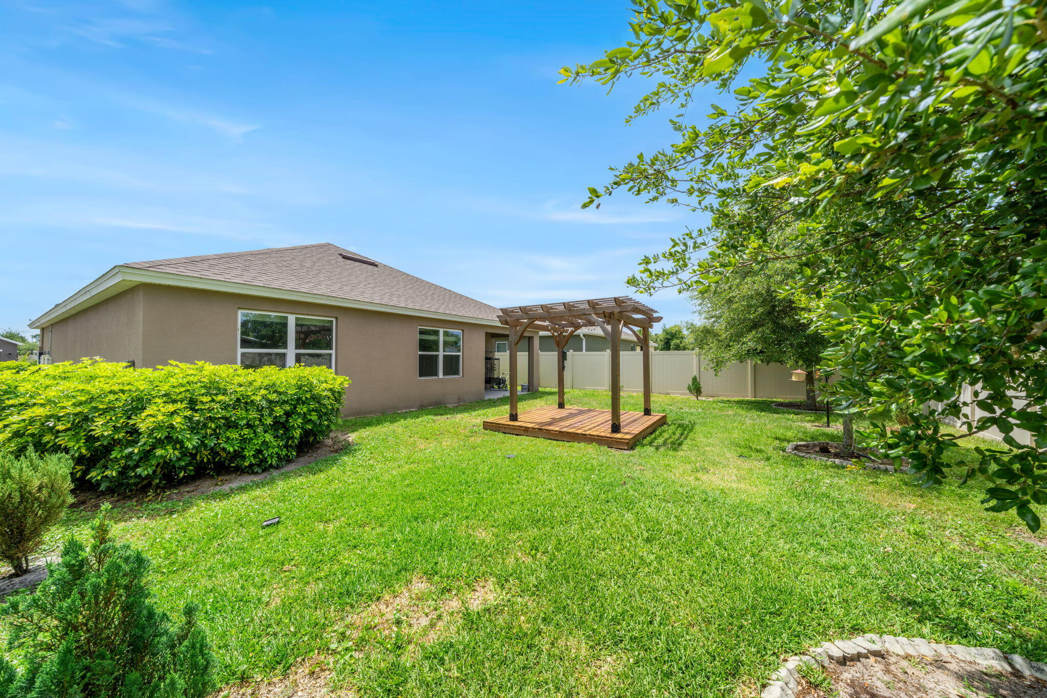 820 Forest Trace Circle Titusville, FL 32780 - Photo 25 of 27 a view of a house with a yard porch and sitting area