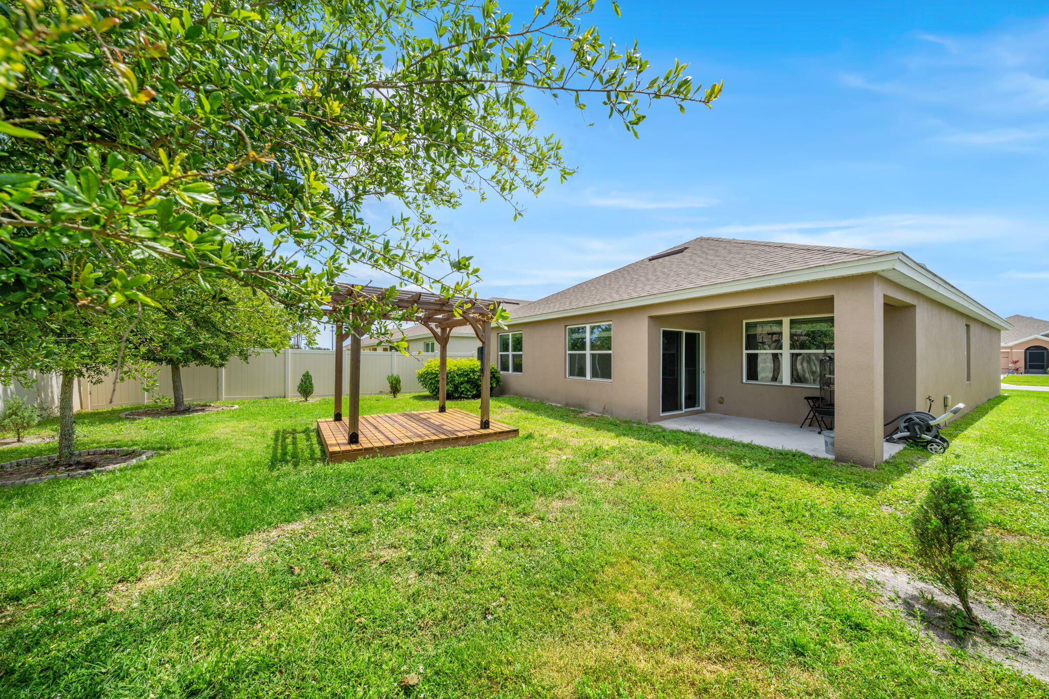 820 Forest Trace Circle Titusville, FL 32780 - Photo 26 of 27 a view of a house with a backyard