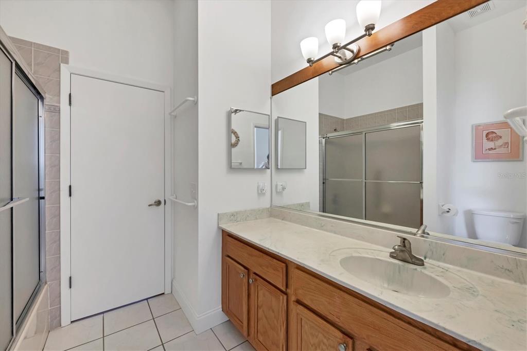 4115 Hemingway Drive Venice, FL 34293 - Photo 22 of 41 a bathroom with a sink and a mirror