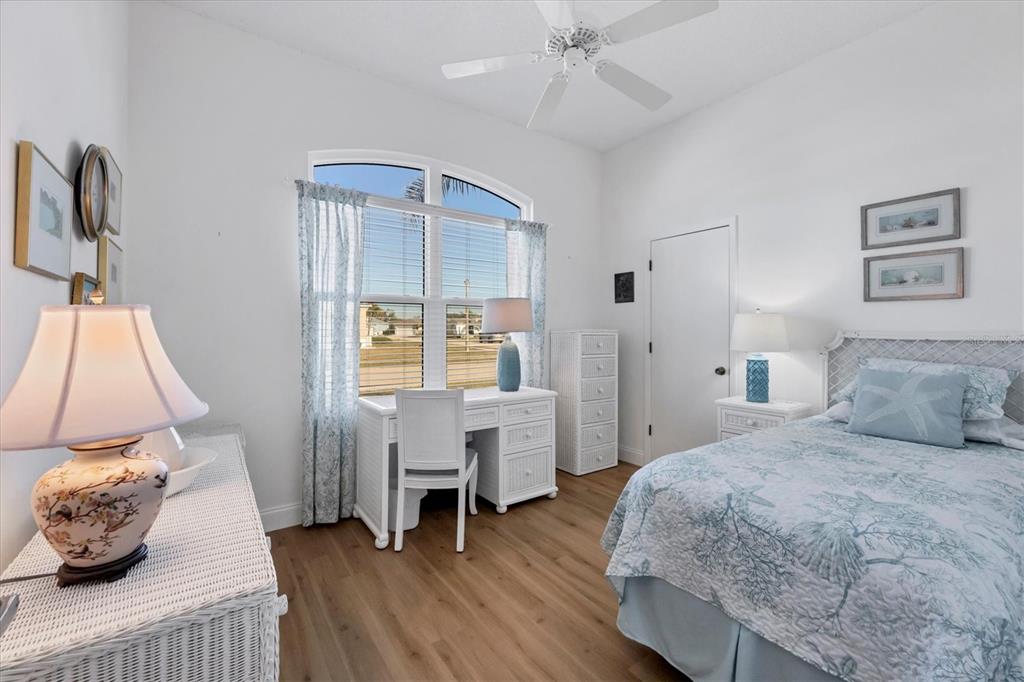 4115 Hemingway Drive Venice, FL 34293 - Photo 23 of 41 a bedroom with a bed and a table